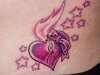 Pink heart tattoo with stars