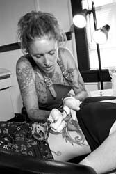 female getting a tattoo